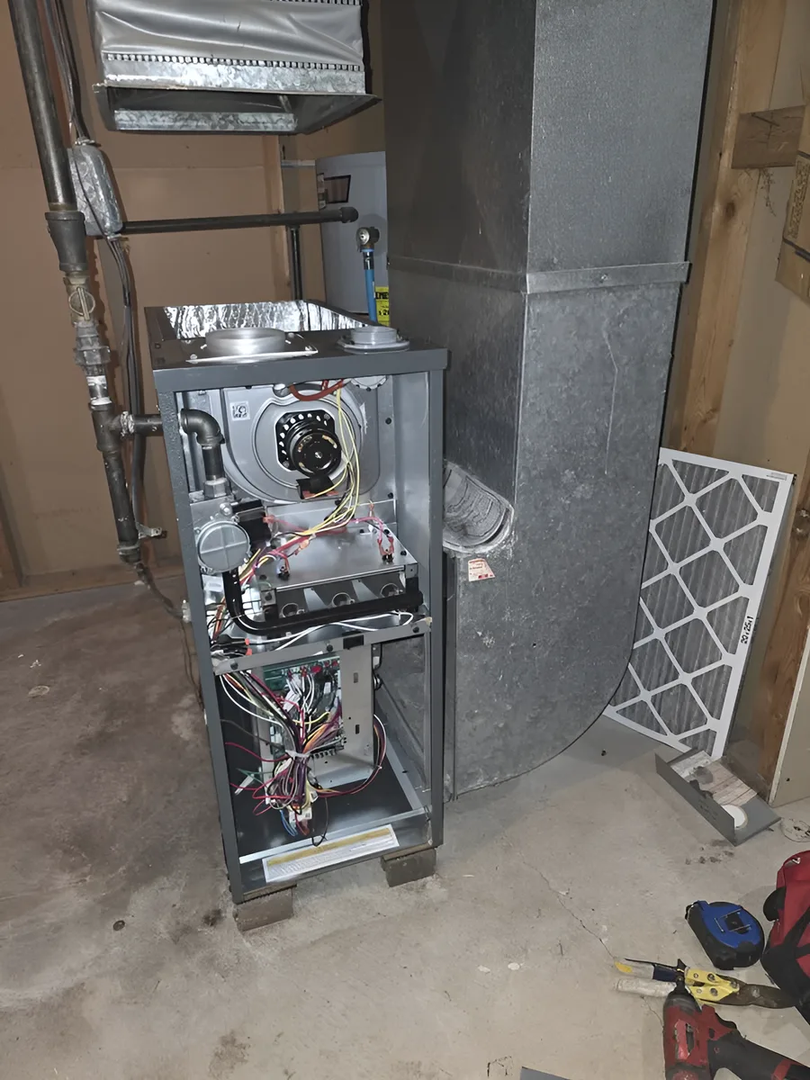 Open residential furnace cabinet during diagnostic work